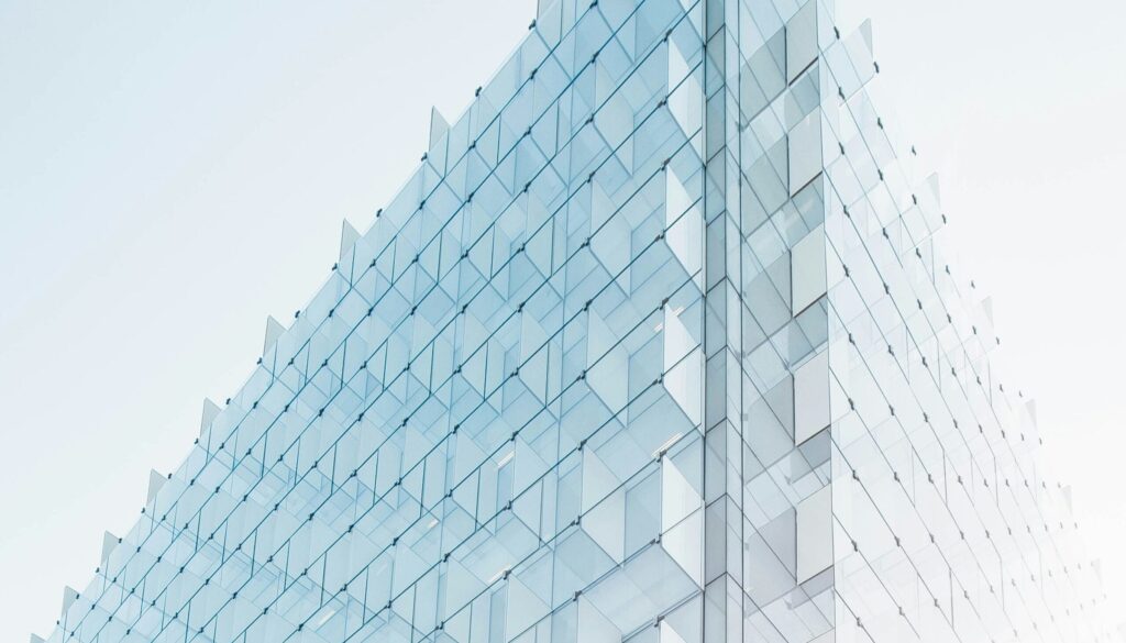 glass building under clear glass building under clear blue sky