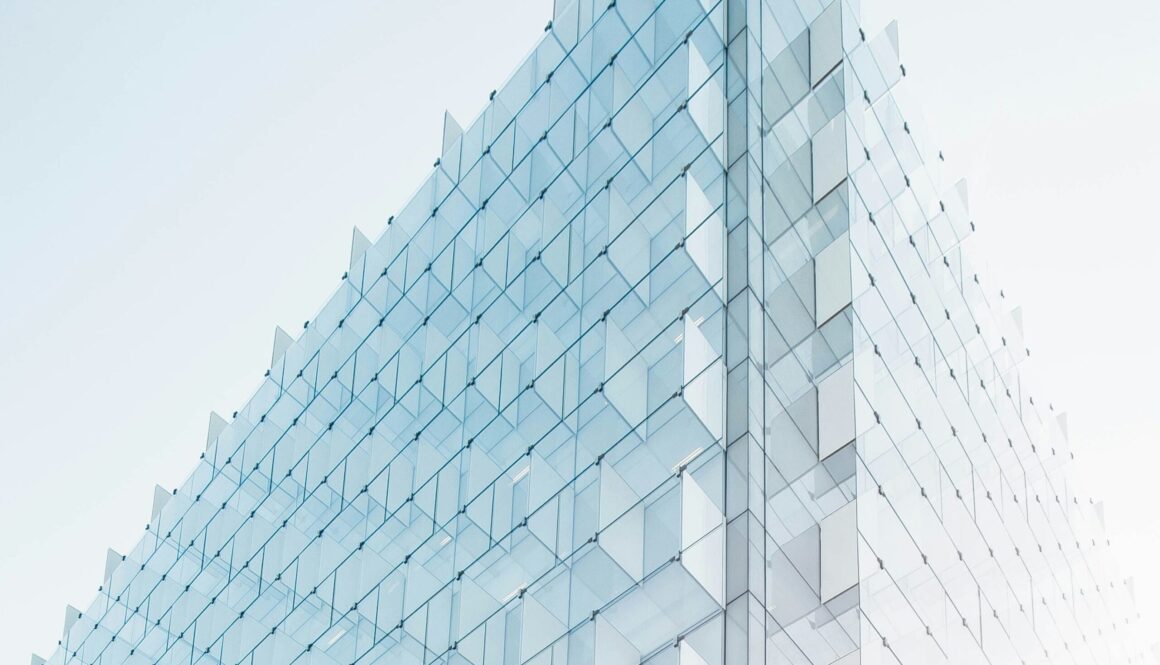 glass building under clear glass building under clear blue sky