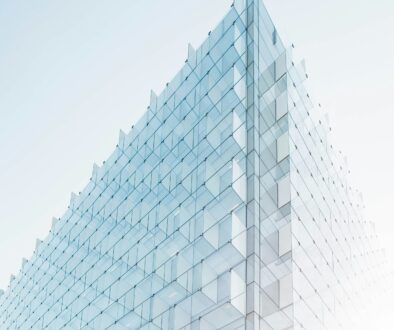 glass building under clear glass building under clear blue sky